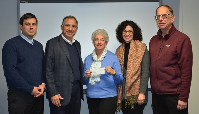 Acceptance of donation check, from left to right: Peter Zimmar of Heritage Realty; Ed Dorian Jr. of Dorian Drake Intl.; Carole Troum of Hope Community Services and Annette M. Peters-Ruvolo of the Continuum of Care; and Andy Kimerling of the Westchester Track Club.